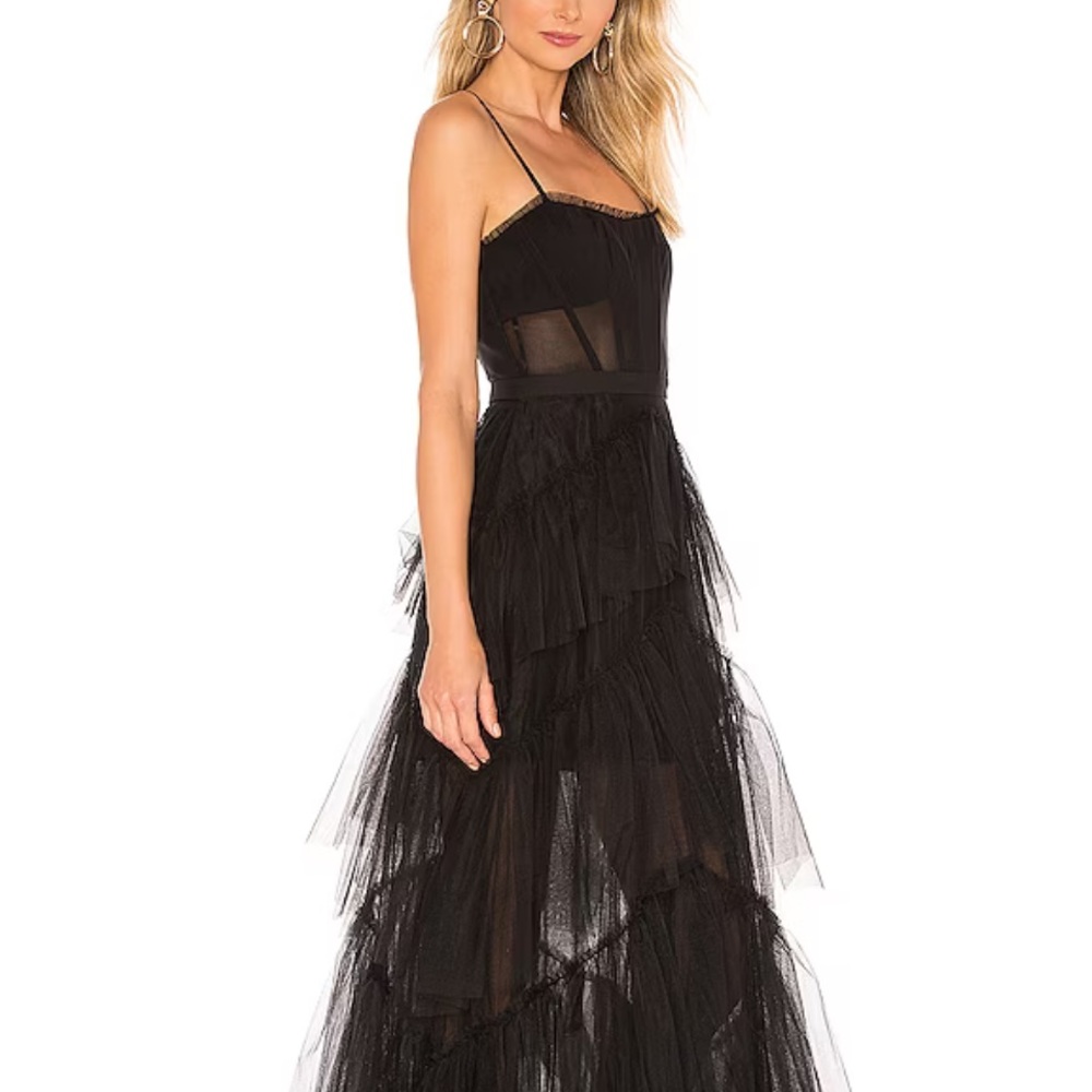 Stunning sheer tulle evening gown worn once. Just enough sheer strap/strapless